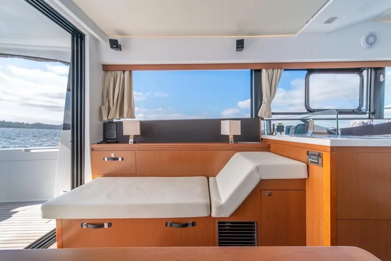  Yacht Photos Pics Interior of 2016 Jeanneau Velasco 43F yacht with modern seating and ocean view.