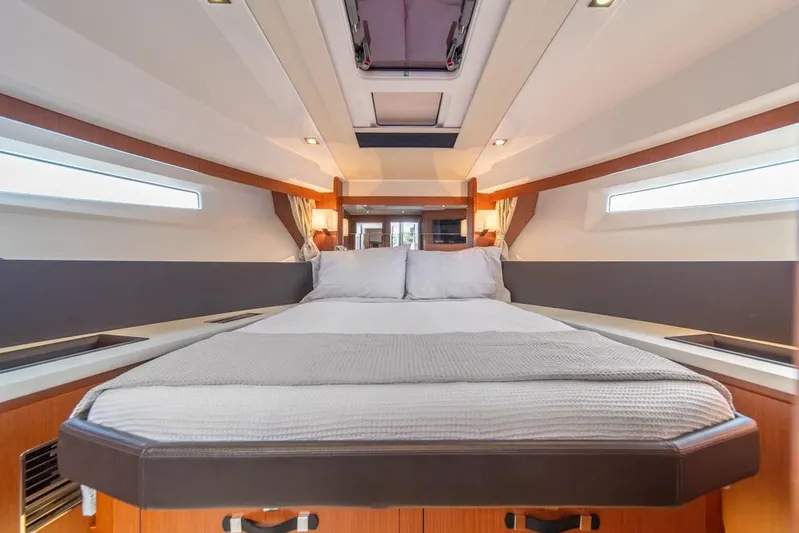  Yacht Photos Pics Luxurious cabin interior of 2016 Jeanneau Velasco 43F yacht with cozy bedding.