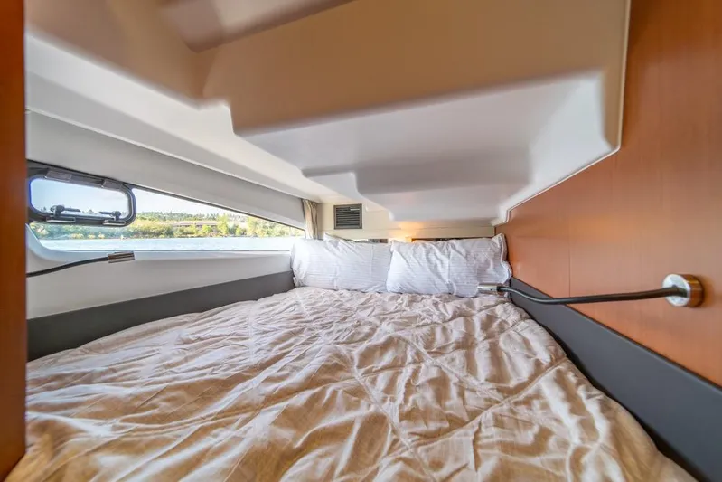  Yacht Photos Pics Cozy cabin interior of 2016 Jeanneau Velasco 43F yacht with scenic window view.