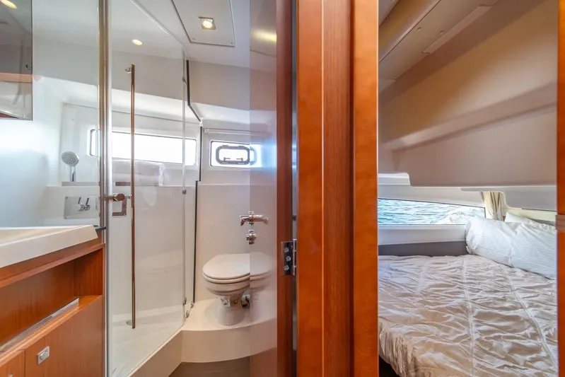  Yacht Photos Pics Interior of 2016 Jeanneau Velasco 43F yacht showing bathroom and bedroom.