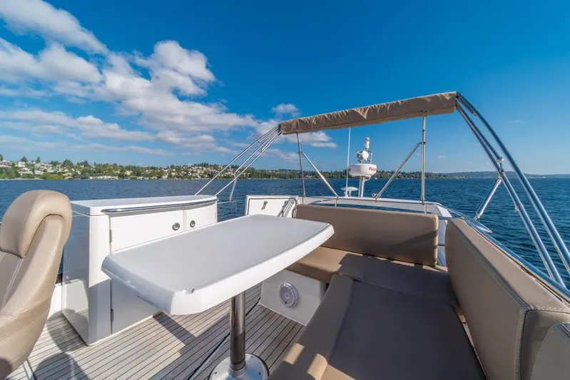  Yacht Photos Pics Flybridge view of 2016 Jeanneau Velasco 43F yacht on a sunny day.