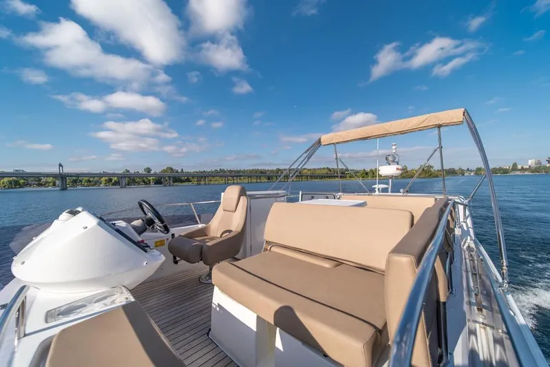  Yacht Photos Pics 2016 Jeanneau Velasco 43F yacht cruising on a sunny day with clear blue skies.