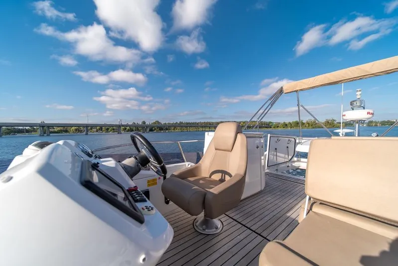  Yacht Photos Pics 2016 Jeanneau Velasco 43F yacht helm with scenic river view.