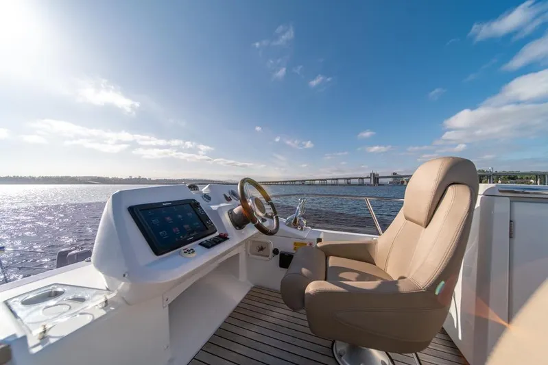  Yacht Photos Pics Helm of 2016 Jeanneau Velasco 43F yacht with scenic water view.