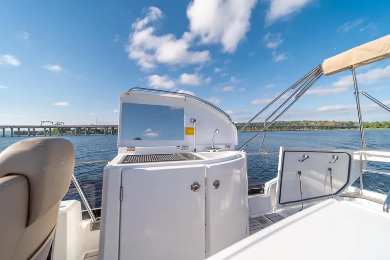  Yacht Photos Pics 2016 Jeanneau Velasco 43F yacht deck with scenic water view and clear skies.