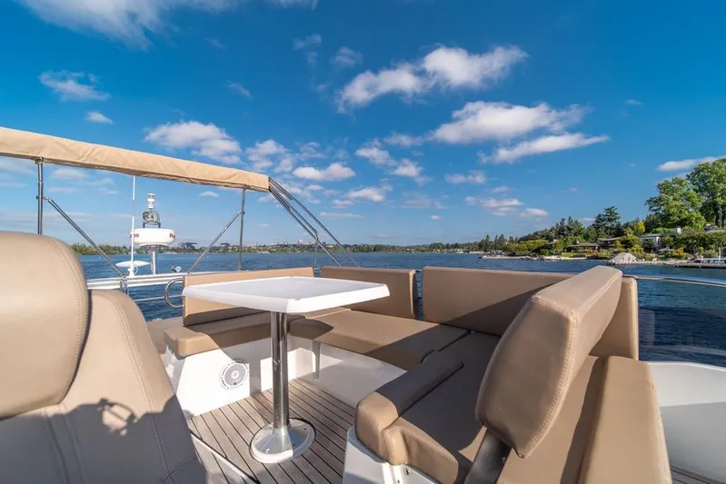  Yacht Photos Pics Flybridge seating area on 2016 Jeanneau Velasco 43F yacht, with scenic water view.