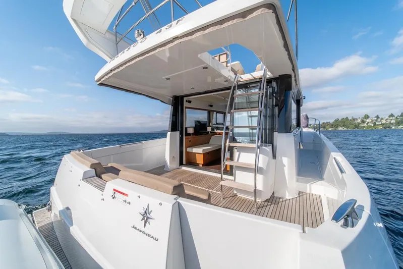  Yacht Photos Pics 2016 Jeanneau Velasco 43F yacht on open water, showcasing spacious deck and modern design.