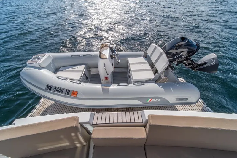  Yacht Photos Pics Inflatable boat with outboard motor on Jeanneau Velasco 43F yacht, 2016 model, on open water.