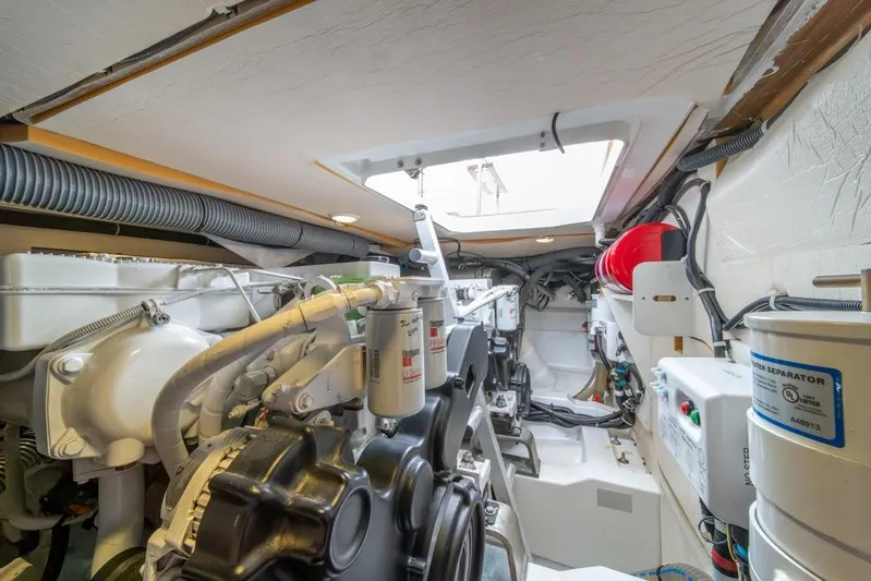  Yacht Photos Pics Engine room of 2016 Jeanneau Velasco 43F yacht, showcasing mechanical components and systems.