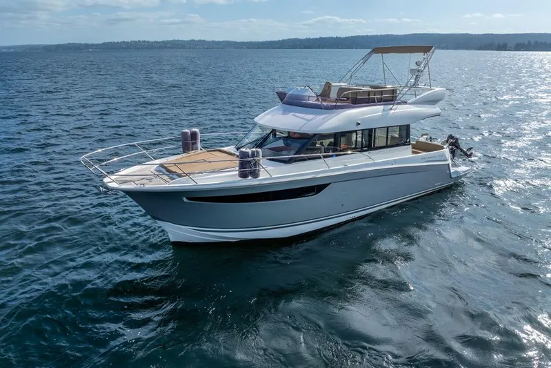  Yacht Photos Pics 2016 Jeanneau Velasco 43F yacht cruising on open water under clear skies.