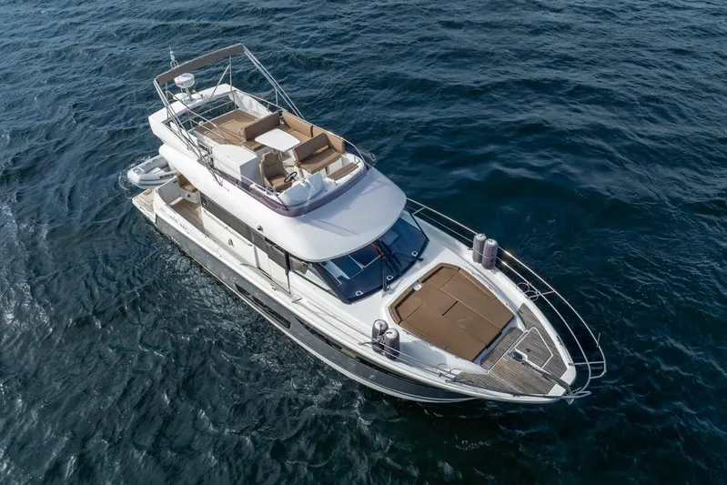  Yacht Photos Pics 2016 Jeanneau Velasco 43F yacht cruising on open water, aerial view.