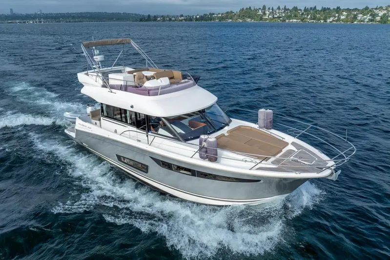  Yacht Photos Pics 2016 Jeanneau Velasco 43F yacht cruising on open water, showcasing sleek design and luxury.