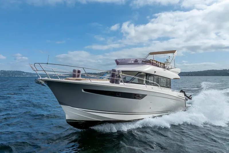  Yacht Photos Pics 2016 Jeanneau Velasco 43F yacht cruising on open water under a clear sky.