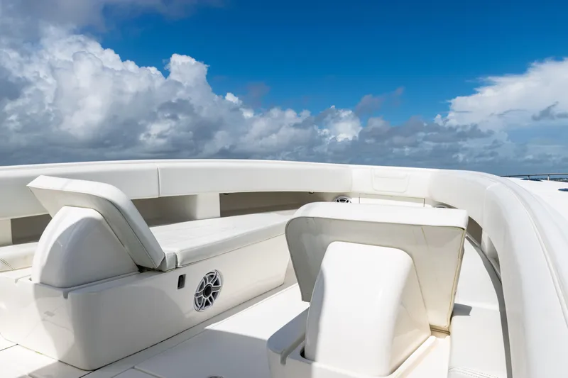  Yacht Photos Pics 2023 SeaVee 340Z boat interior with white seating under a blue sky.