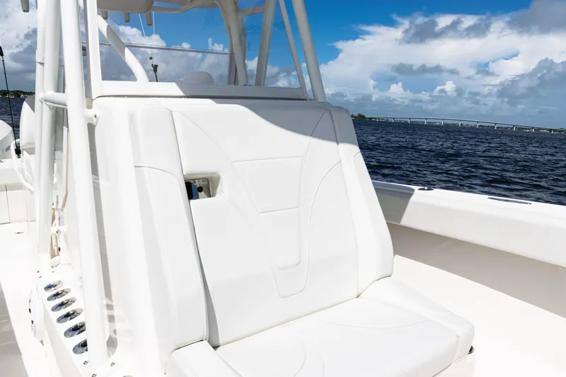  Yacht Photos Pics 2023 SeaVee 340Z boat interior with white seating, ocean view, and blue sky.