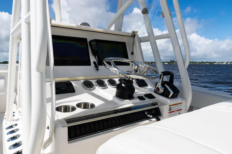  Yacht Photos Pics 2023 SeaVee 340Z boat dashboard with steering wheel and navigation screens.