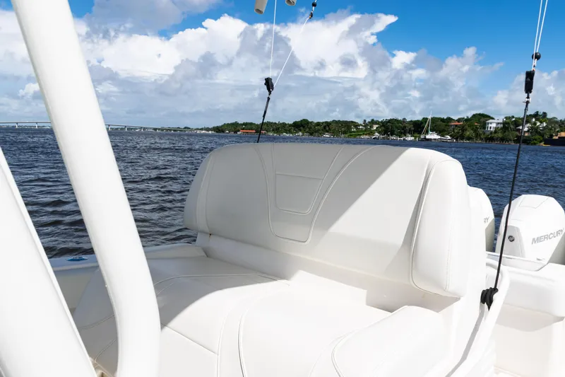  Yacht Photos Pics 2023 SeaVee 340Z boat interior with white seating, on a sunny day by the water.
