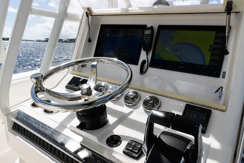  Yacht Photos Pics 2023 SeaVee 340Z boat dashboard with steering wheel and navigation screens.