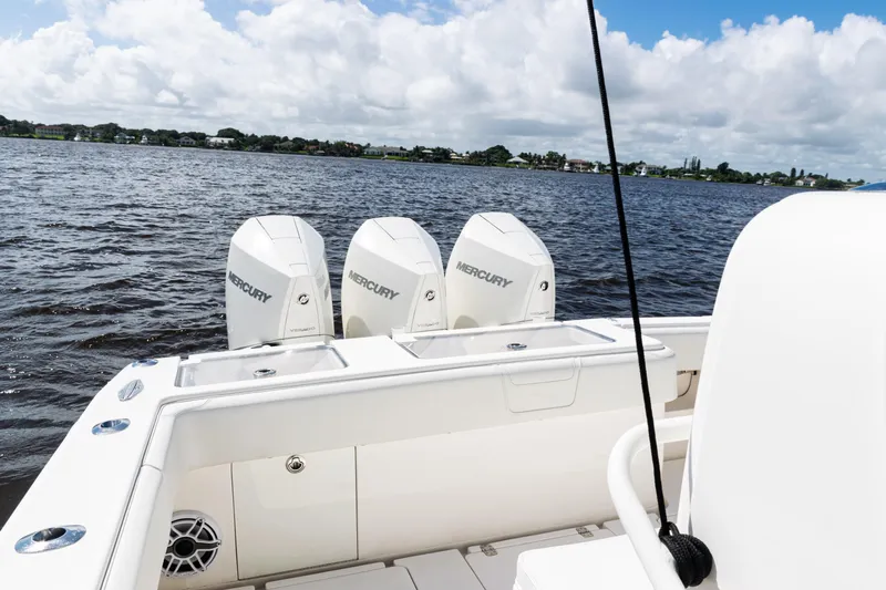  Yacht Photos Pics 2023 SeaVee 340Z boat with triple Mercury engines on a calm lake.