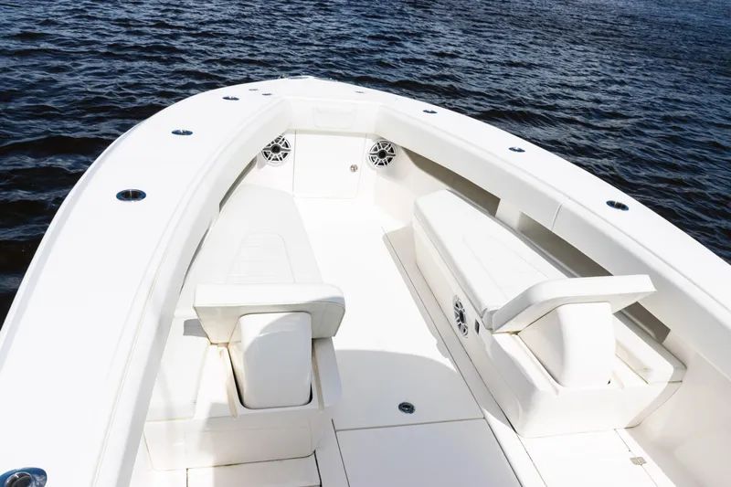  Yacht Photos Pics 2023 SeaVee 340Z boat interior with white seating, on calm water.
