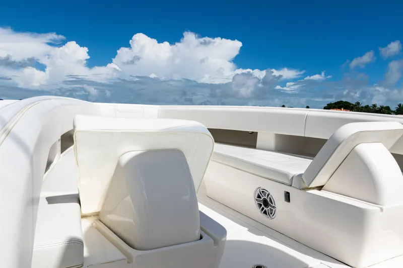  Yacht Photos Pics 2023 SeaVee 340Z boat interior with white seating under a clear blue sky.