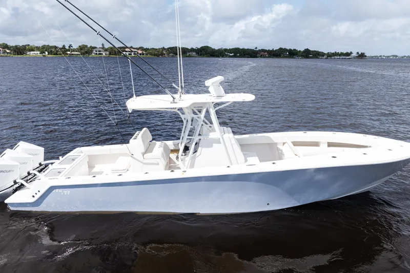  Yacht Photos Pics 2023 SeaVee 340Z boat on calm water, featuring sleek design and modern amenities.