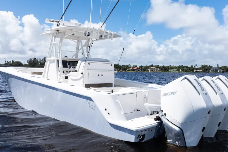  Yacht Photos Pics 2023 SeaVee 340Z boat with triple Mercury engines on a sunny day.