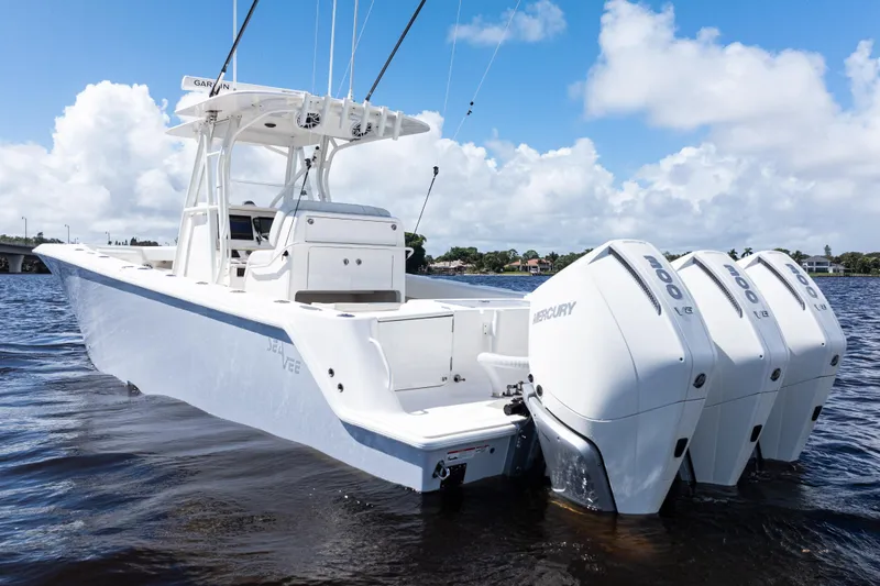  Yacht Photos Pics 2023 SeaVee 340Z boat with triple Mercury engines on a sunny day.