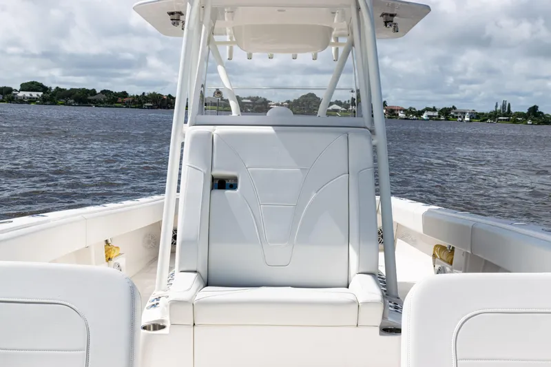  Yacht Photos Pics 2023 SeaVee 340Z boat interior with white seating, on a calm water backdrop.