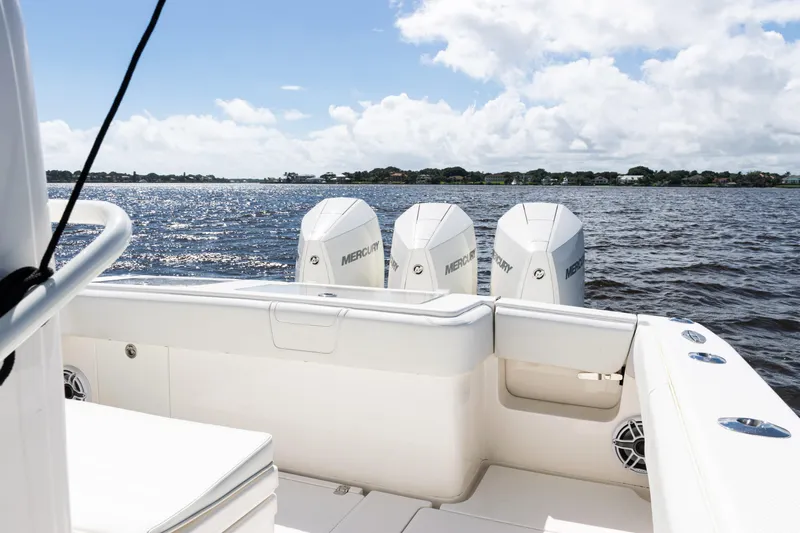  Yacht Photos Pics 2023 SeaVee 340Z boat with triple Mercury engines on a sunny day.