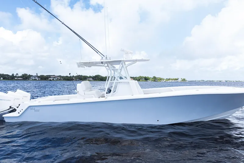  Yacht Photos Pics 2023 SeaVee 340Z boat on calm water under a partly cloudy sky.