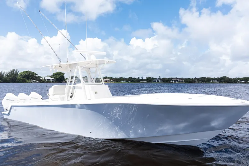  Yacht Photos Pics 2023 SeaVee 340Z boat on calm water under a partly cloudy sky.
