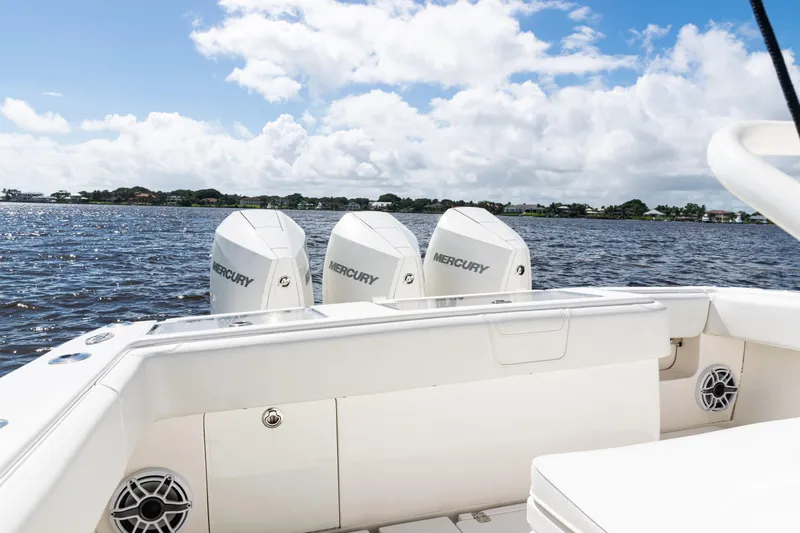  Yacht Photos Pics 2023 SeaVee 340Z boat with triple Mercury engines on a sunny day.