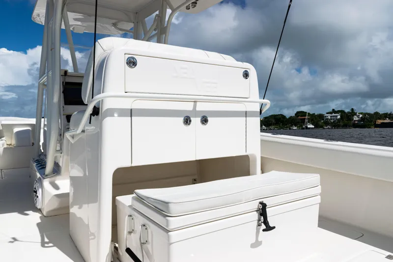  Yacht Photos Pics 2023 SeaVee 340Z boat interior with seating and storage, under a partly cloudy sky.