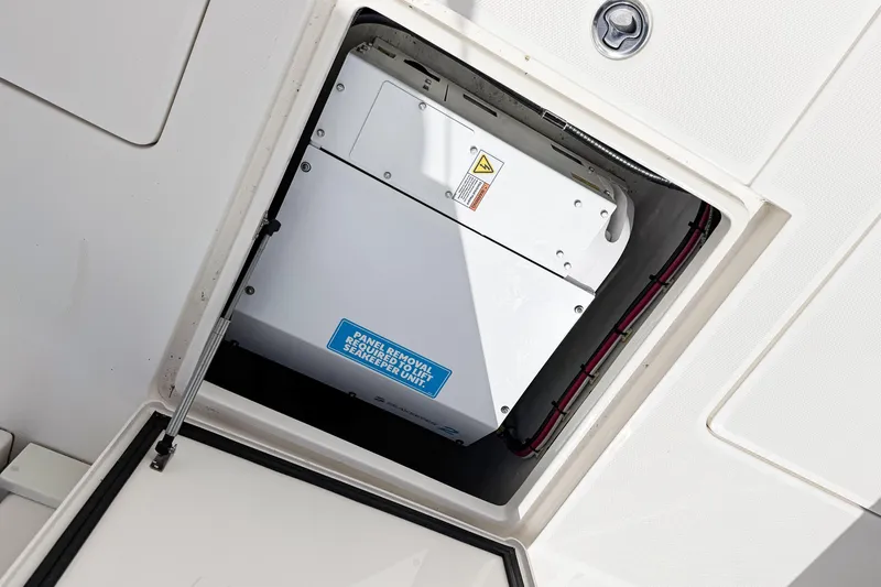  Yacht Photos Pics 2023 SeaVee 340Z boat compartment with Seakeeper unit visible.