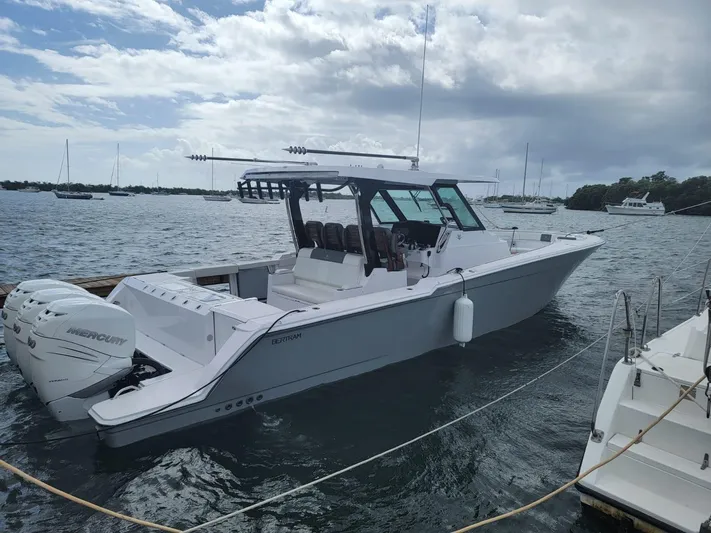  Yacht Photos Pics 2022 Bertram 39 CC boat docked in a marina with Mercury engines.