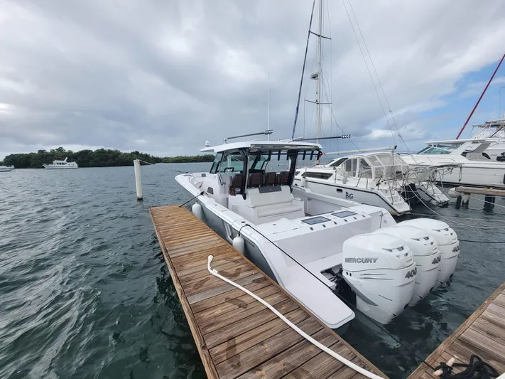  Yacht Photos Pics 2022 Bertram 39 CC boat docked with triple Mercury engines.