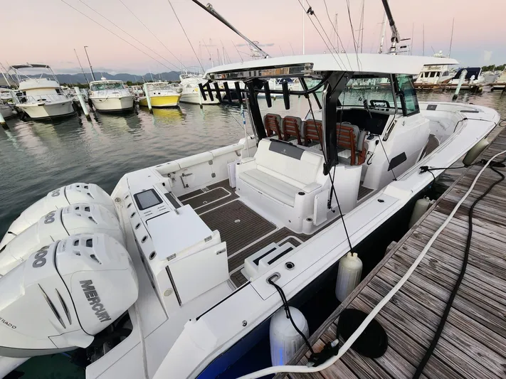  Yacht Photos Pics 2022 Bertram 39 CC boat docked with triple Mercury engines.