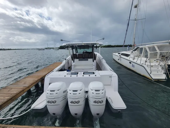  Yacht Photos Pics 2022 Bertram 39 CC boat with triple 400 HP engines docked at marina.