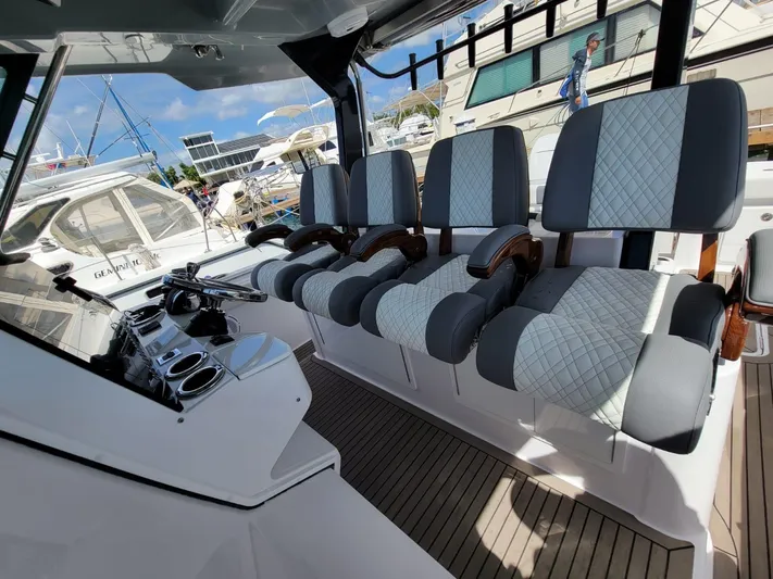  Yacht Photos Pics Interior of 2022 Bertram 39 CC boat with modern seating and controls.