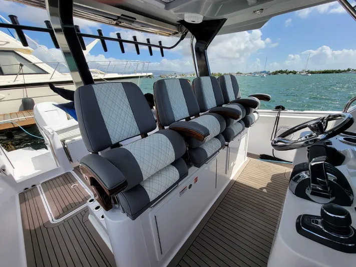  Yacht Photos Pics 2022 Bertram 39 CC boat interior with luxury seating and ocean view.