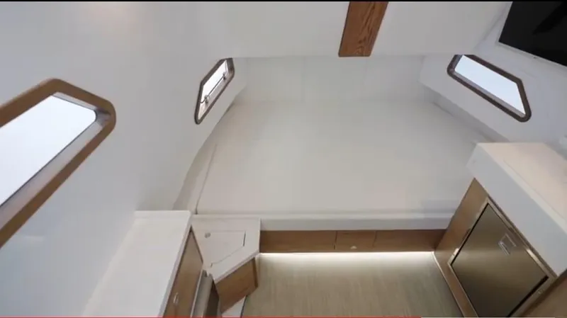  Yacht Photos Pics Interior of 2022 Bertram 39 CC boat cabin with modern design and wood accents.