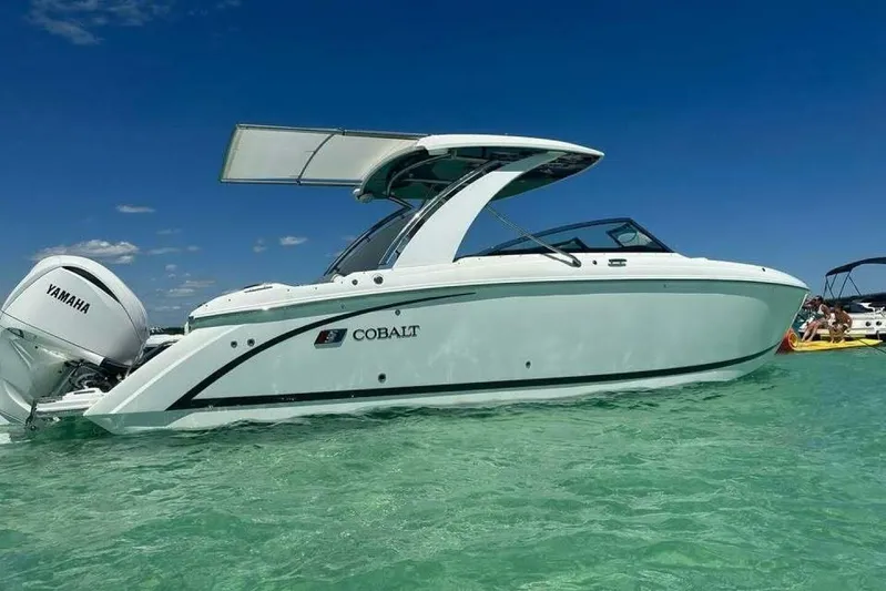  Yacht Photos Pics 2024 Cobalt 30SC Outboard boat on clear water with Yamaha engine.