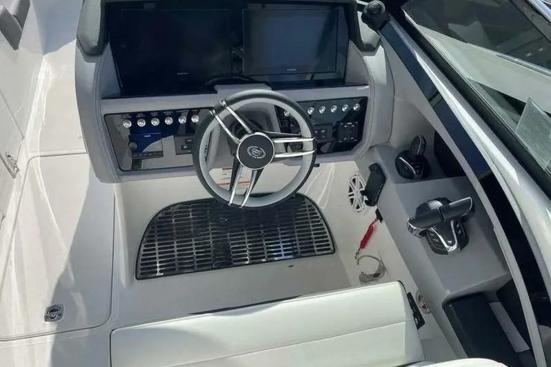  Yacht Photos Pics 2024 Cobalt 30SC Outboard boat cockpit with modern steering and control panel.