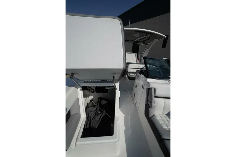  Yacht Photos Pics 2024 Cobalt 30SC Outboard boat interior with open storage compartment.