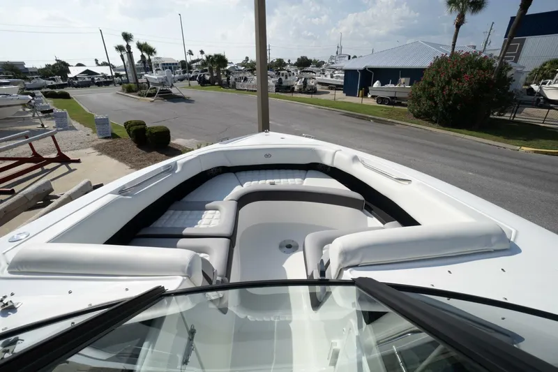  Yacht Photos Pics 2024 Cobalt 30SC Outboard boat with spacious seating, docked at a marina.