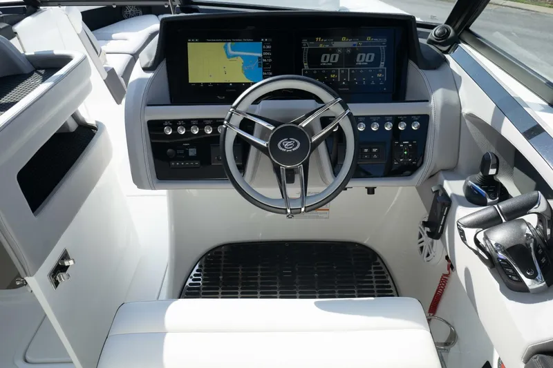  Yacht Photos Pics 2024 Cobalt 30SC Outboard helm with modern controls and navigation display.