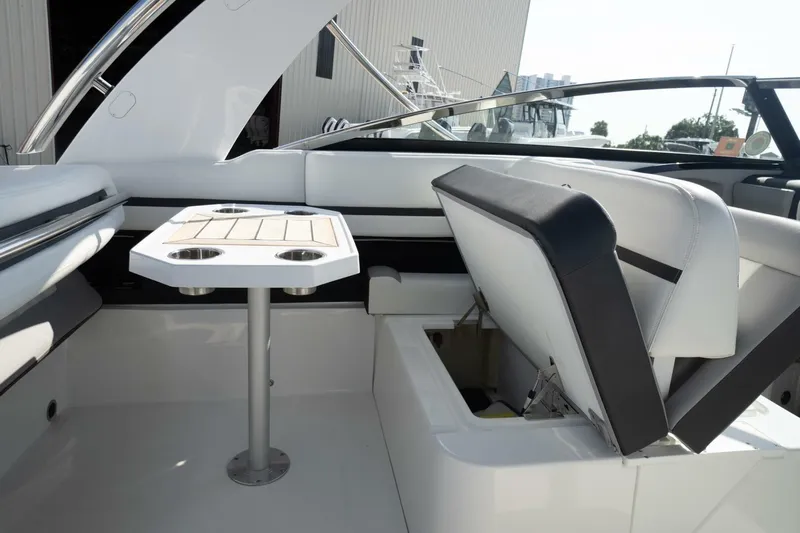  Yacht Photos Pics 2024 Cobalt 30SC Outboard interior with seating and table setup.