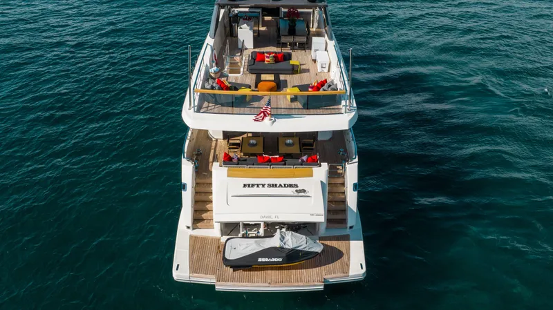 Fifty Shades Yacht Photos Pics Luxury Sanlorenzo SL106 yacht, 2018 model, with spacious deck and jet ski, cruising on open water.
