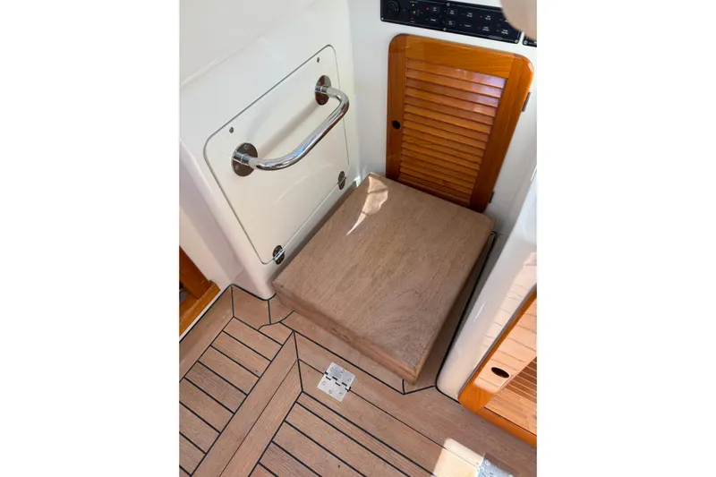 Brass Ring Yacht Photos Pics 2003 Hinckley Talaria 40 interior with wooden flooring and storage compartments.
